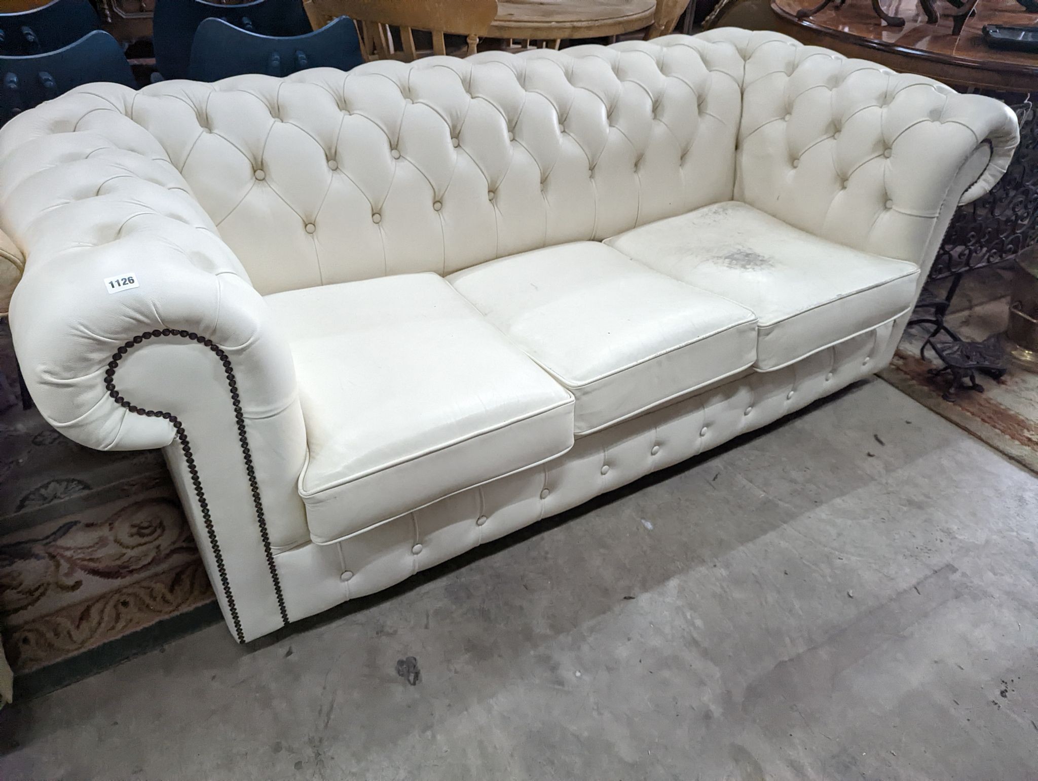A Victorian style buttoned white leather Chesterfield settee, length 190cm, depth 86cm, height 72cm